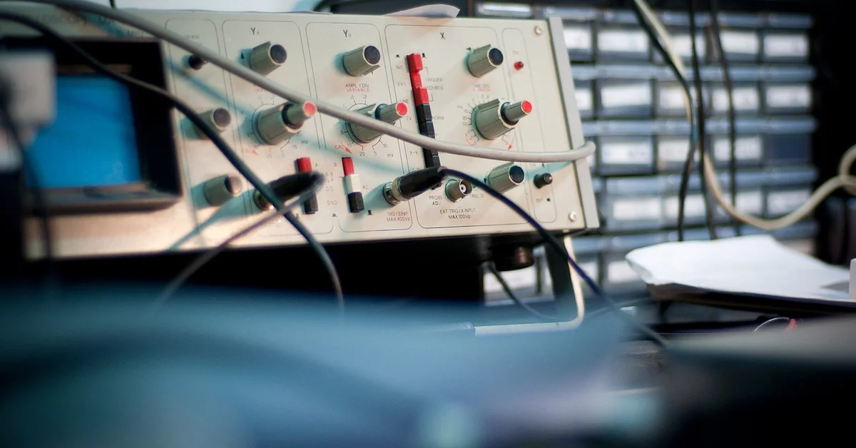 Close-up of laboratory instrumentation with knobs, wires, and connectors, representing advanced tools used in non-animal testing methods.