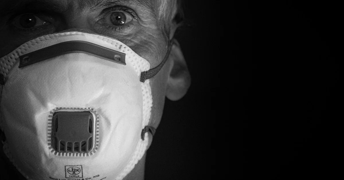 Close-up of a person wearing a respirator mask