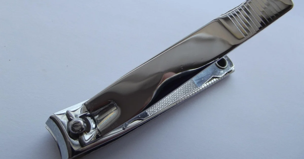 A close-up image of a nail clipper used for grooming pets.